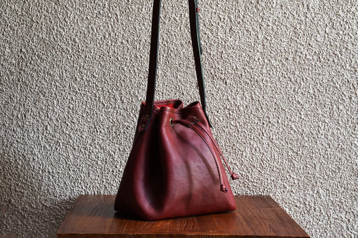 Bucket Bag/Crimson sold by Cravar