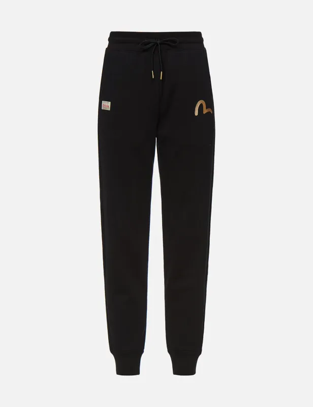Brocade Kamon Appliqué Sweatpants sold by Evisu