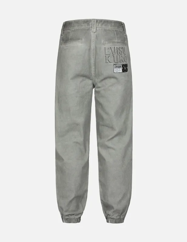 Monogram Embroidered Pocket Garment Dye Jogger Pants sold by Evisu