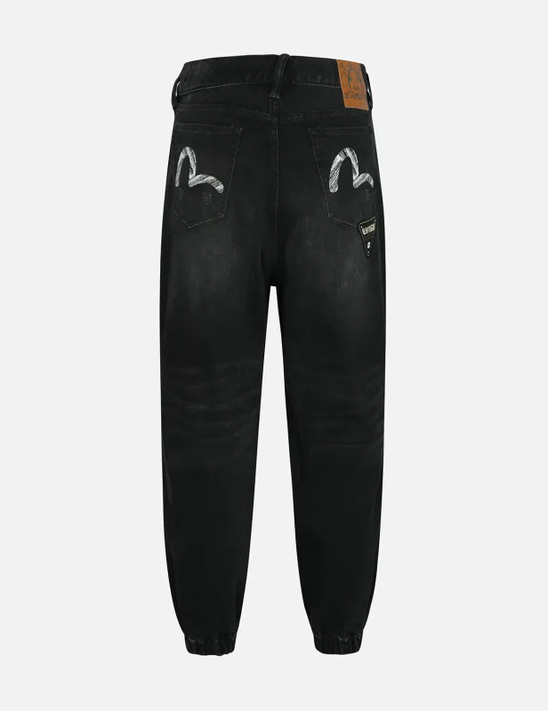 Multi Badges and Seagull Print Loose Fit Denim Joggers sold by Evisu