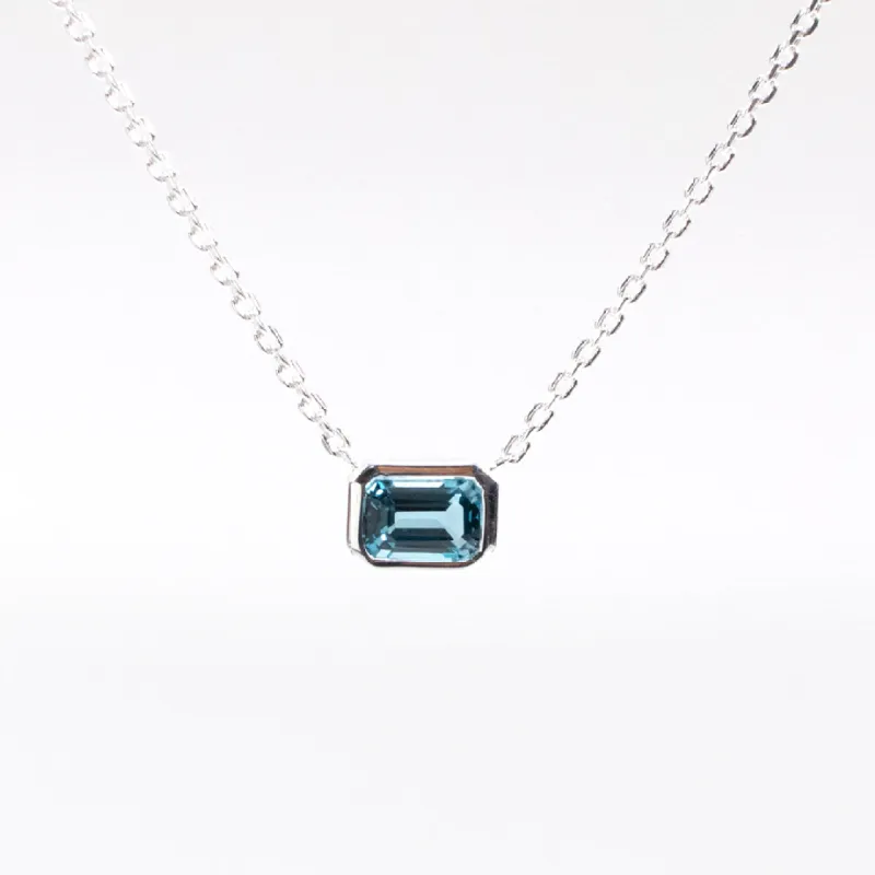 Blue Topaz Bezel Set Solitaire Silver Necklace sold by Silver Lotus