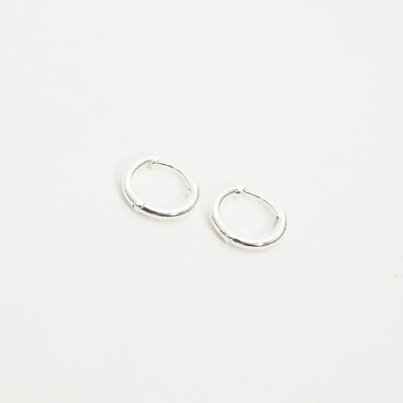 Solid Silver Huggie Hoops sold by Silver Lotus