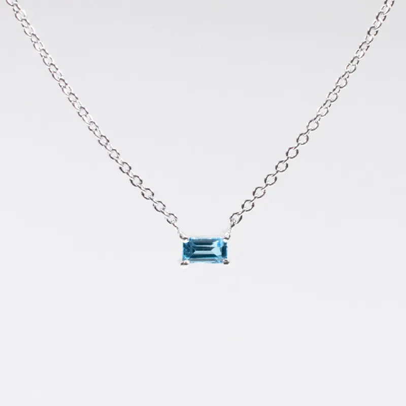 Silver Baguette Solitaire Blue Topaz Necklace sold by Silver Lotus