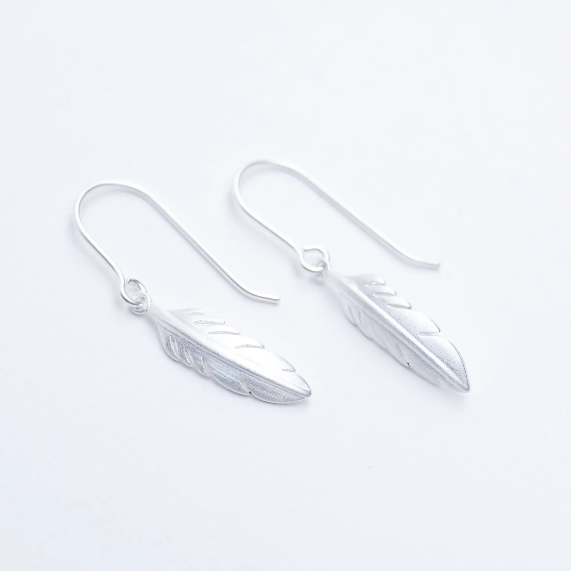 Brushed Silver Feather Dangle Earrings sold by Silver Lotus