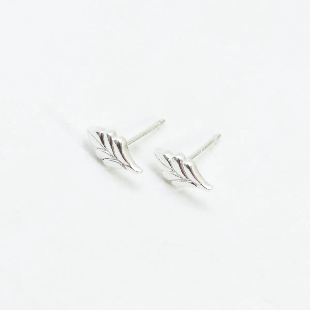 Tiny Silver Leaf Studs sold by Silver Lotus