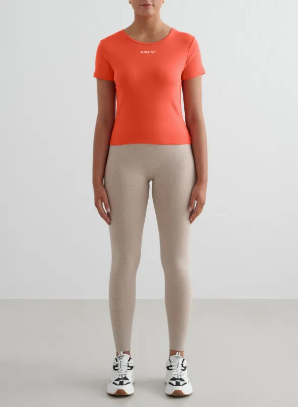 Beige Melange Shape Seamless Tights & Tangerine Stretch T-Shirt Set sold by Aimn