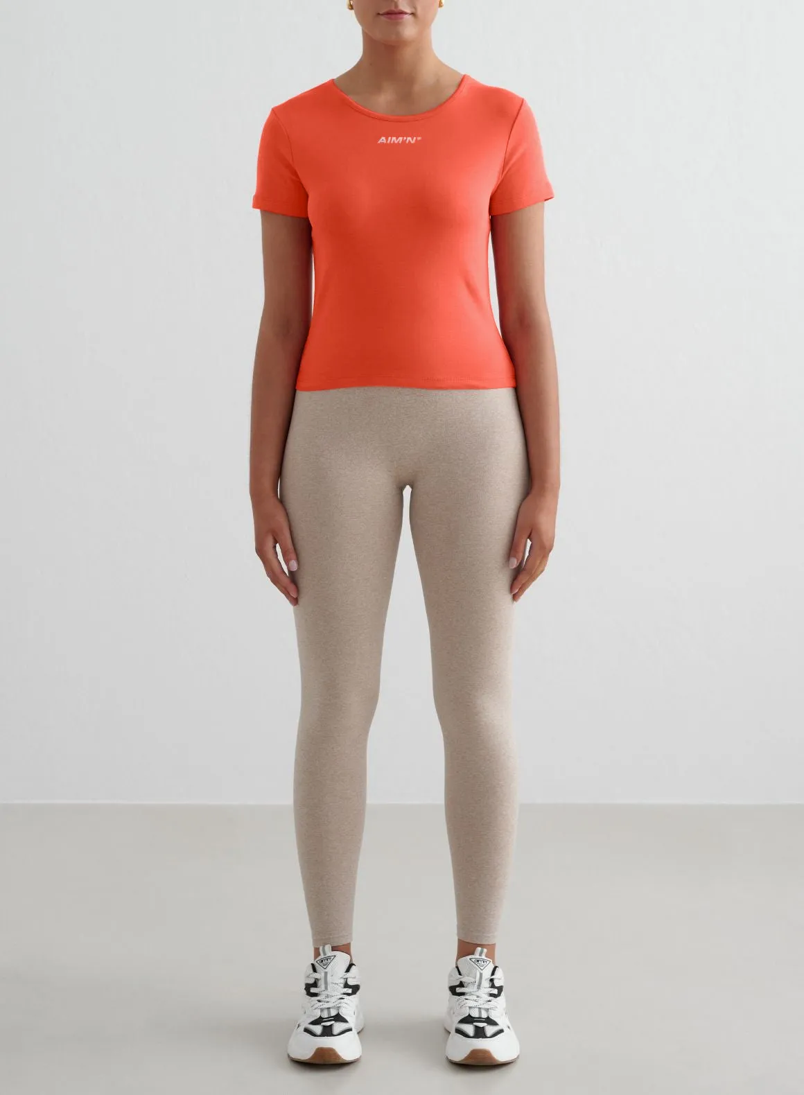 Beige Melange Shape Seamless Tights & Tangerine Stretch T-Shirt Set sold by Aimn