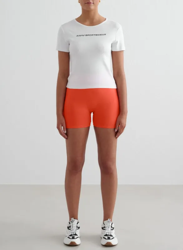 Tangerine Shape Seamless Hotpants & White Stretch T-Shirt Set sold by Aimn
