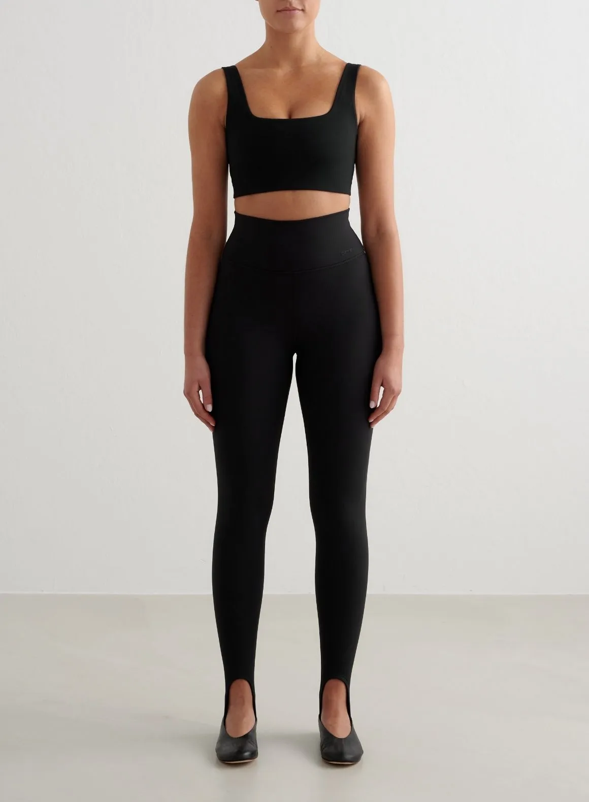 Black Sense Stirrup Tights sold by Aimn