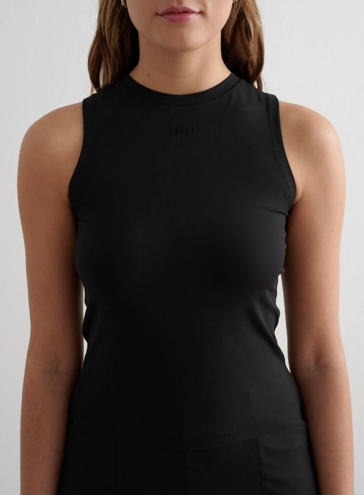 Black Essence Singlet sold by Aimn