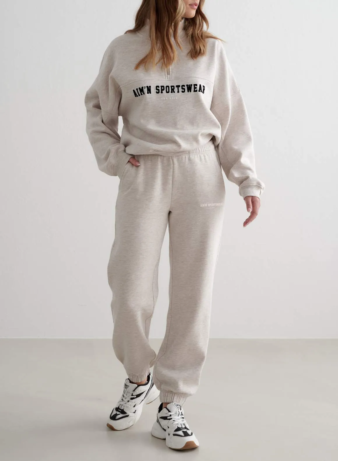 Beige Melange Classic Sweatpants sold by Aimn