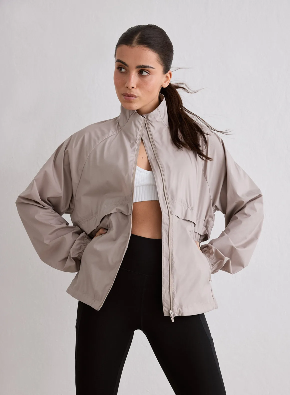 Dark Clay Running Jacket sold by Aimn