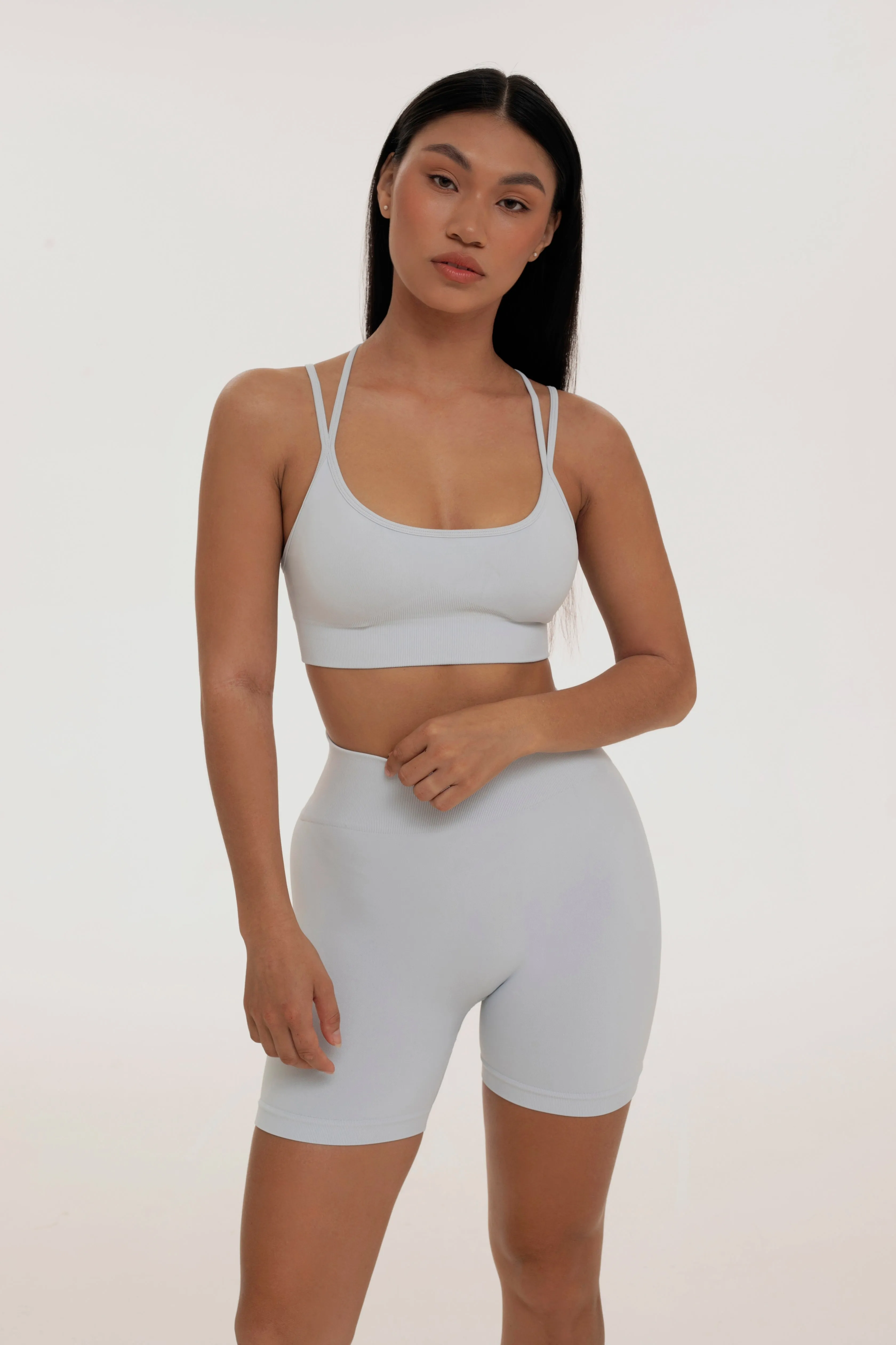 Grayish cross back top sold by Foxy Activewear