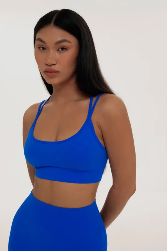 Azure cross back top sold by Foxy Activewear
