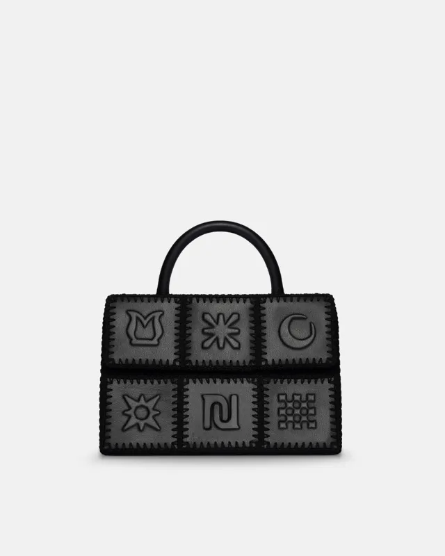 The SANDI Symbol - Top handle bag - Black made by Nanushka