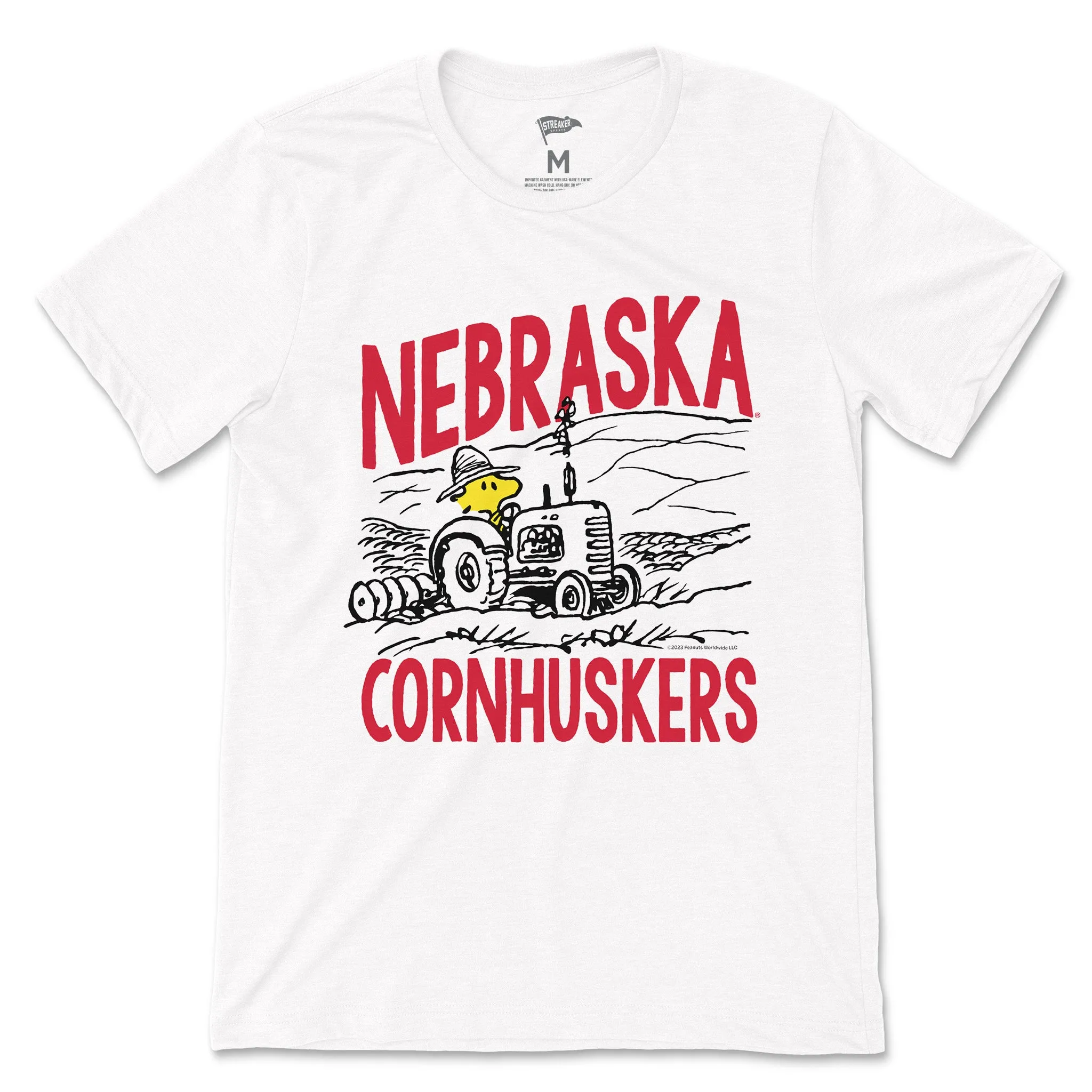 Peanuts x Nebraska Woodstock Farmer Tee sold by Streaker Sports