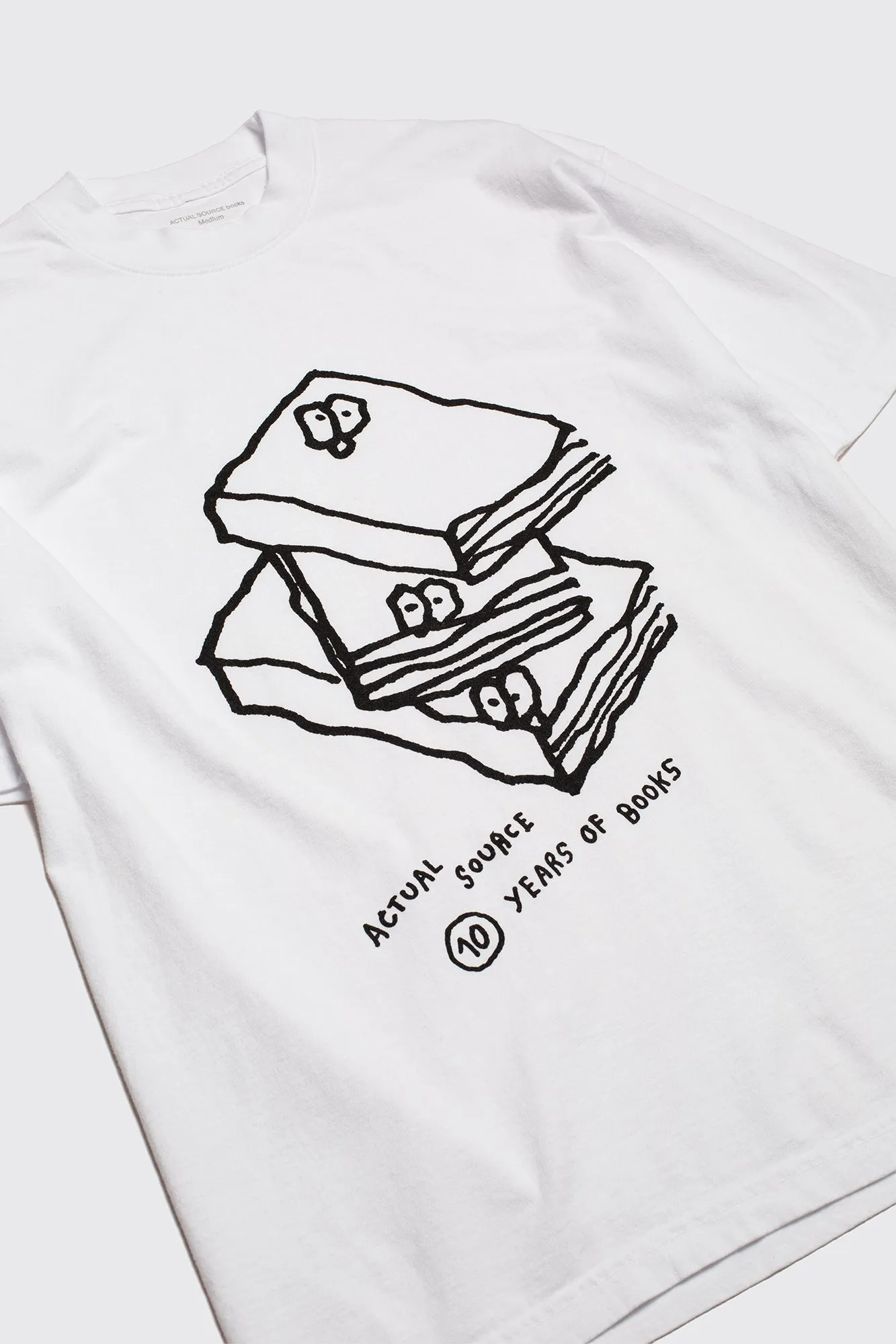 10 Years: Book Stack Tee sold by Actual Source Books product image thumbnail 2