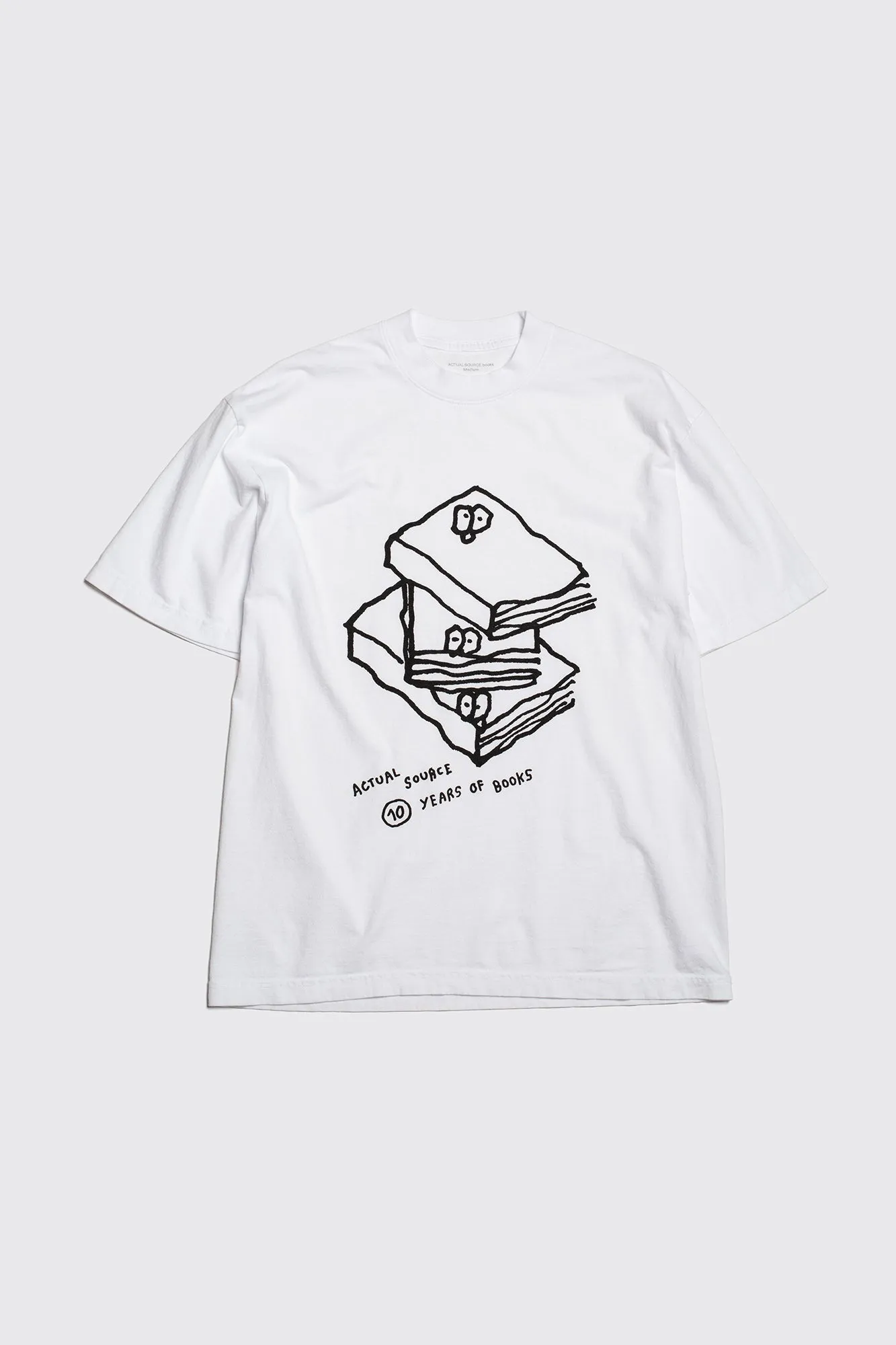 10 Years: Book Stack Tee sold by Actual Source Books