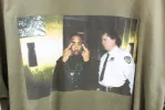 Z - Tupac Flipping The Bird & Cop Picture Tee sold by HG Vintage