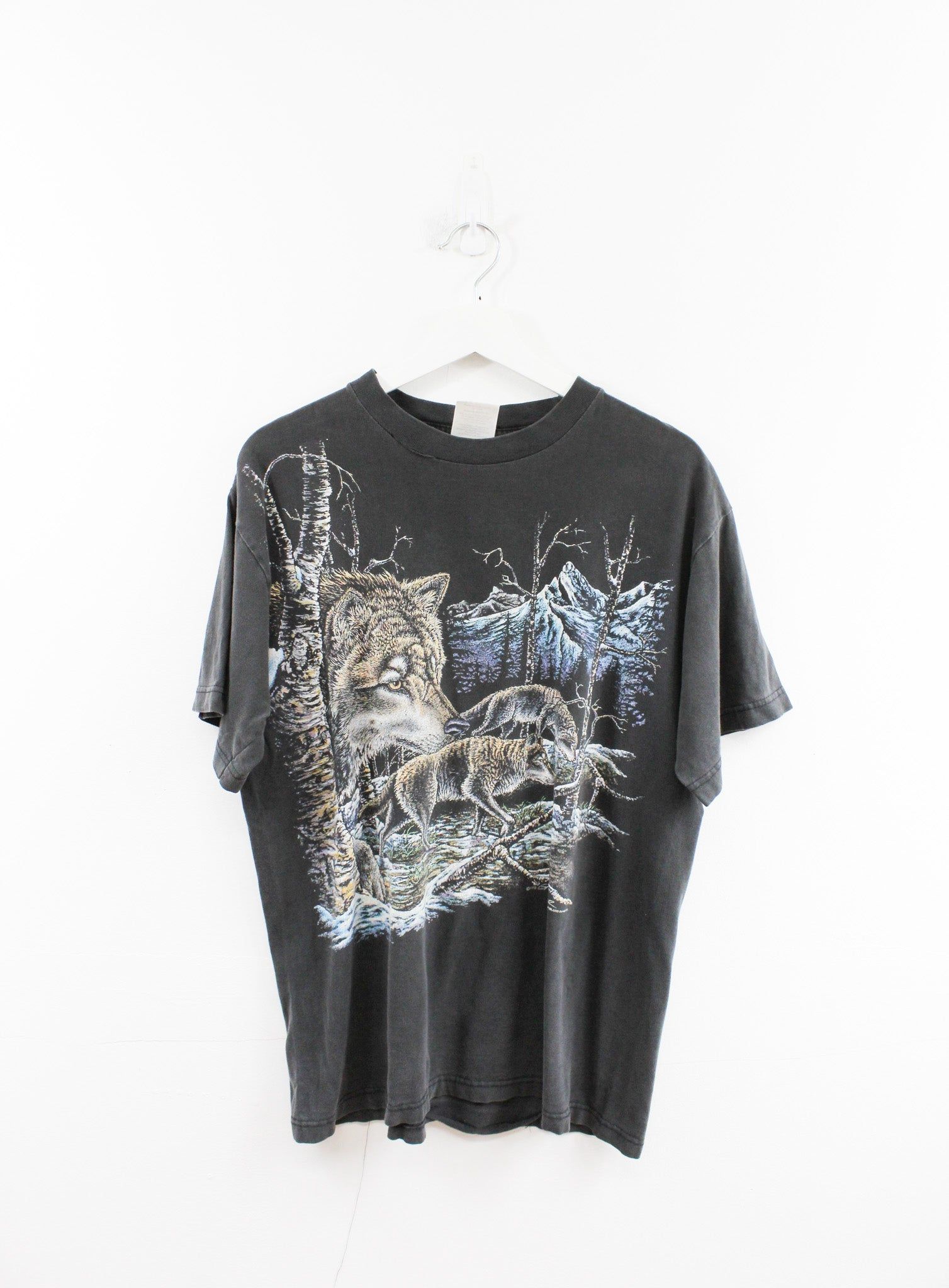 Wolves In Snowy Forest Tee sold by HG Vintage