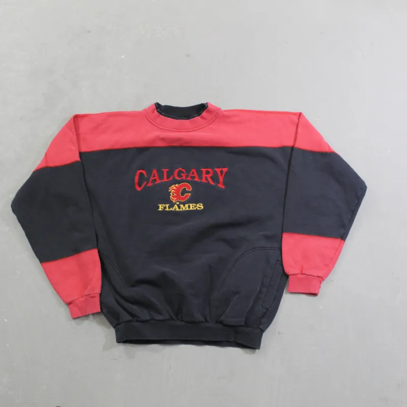 D- Vintage Calgary Flames NHL Embroidered Logo Crewneck sold by HG Vintage