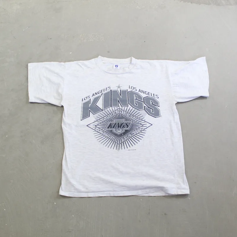 D- Vintage 1992 Los Angeles Kings NHL Logo 7 Graphic & Script Tee sold by HG Vintage