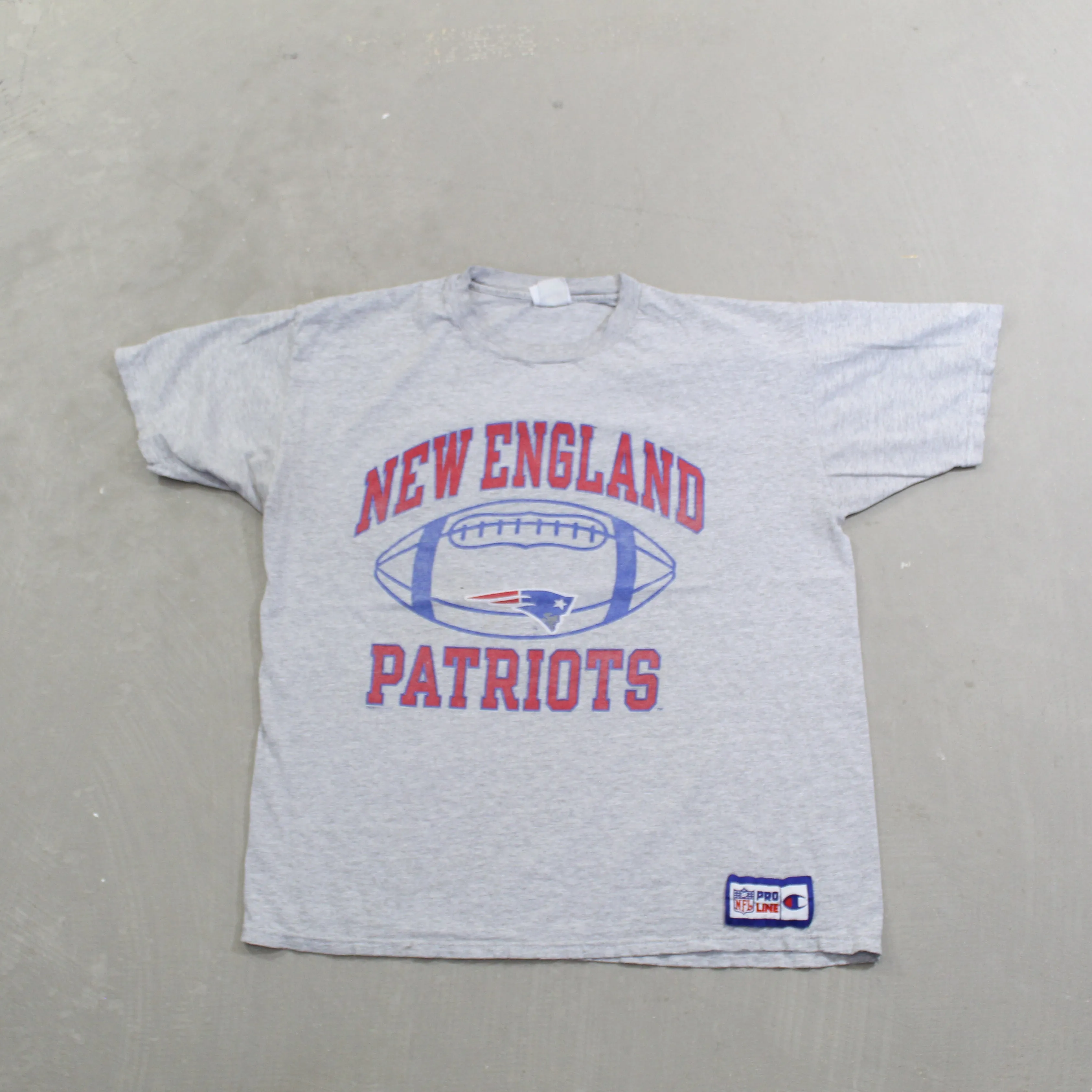 D- Vintage New England Patriots NFL Champion Pro Line Football tee sold by HG Vintage