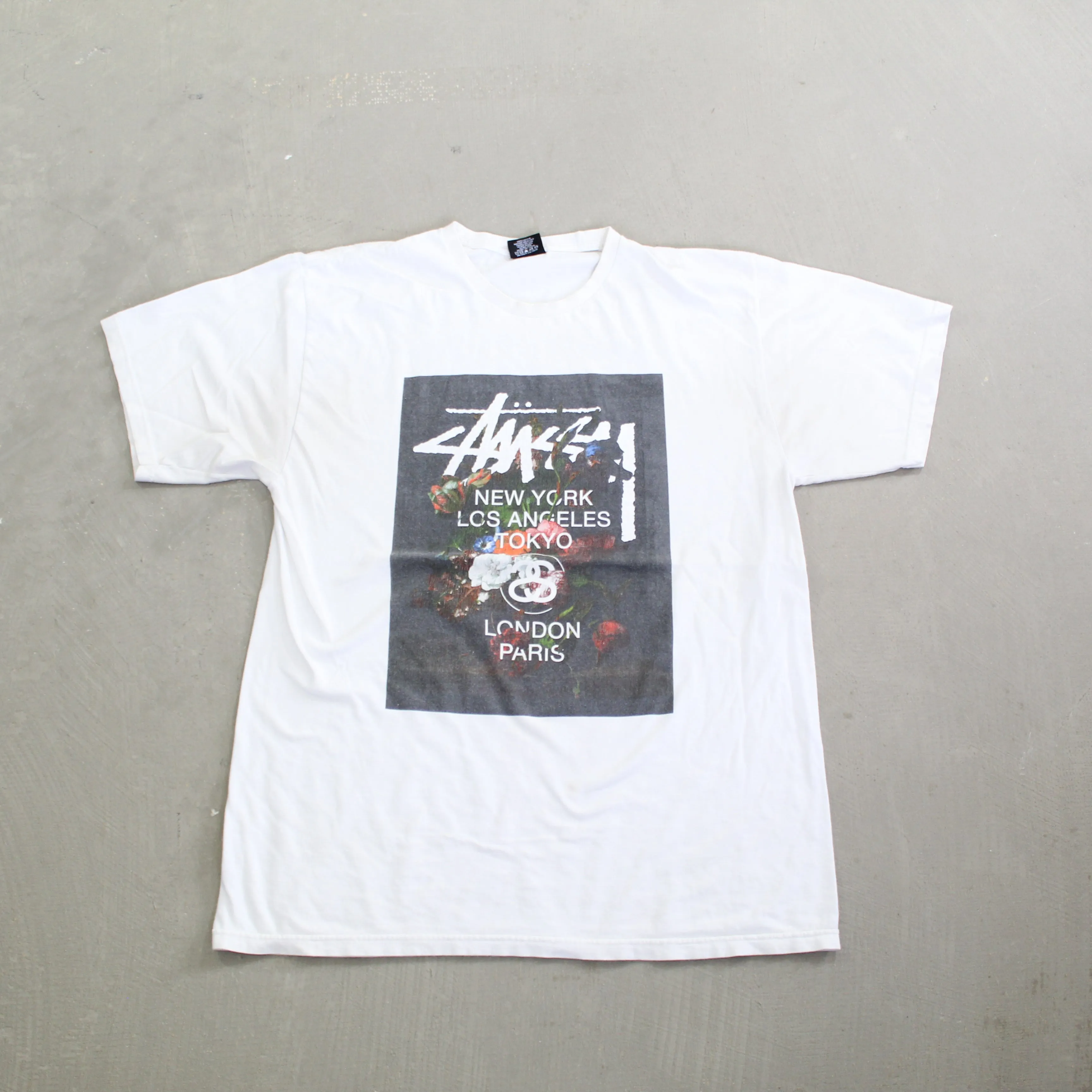 D- Vintage Stussy Flowers & Text Tee sold by HG Vintage