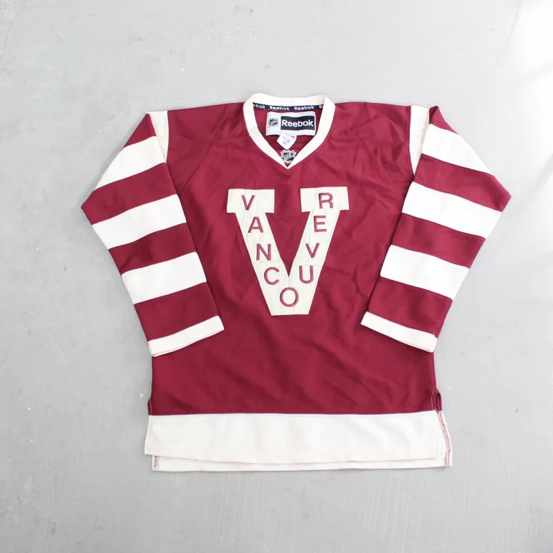 D- Vintage Vancouver Canucks NHL Reebok Embroidered Text Hockey Jersey sold by HG Vintage