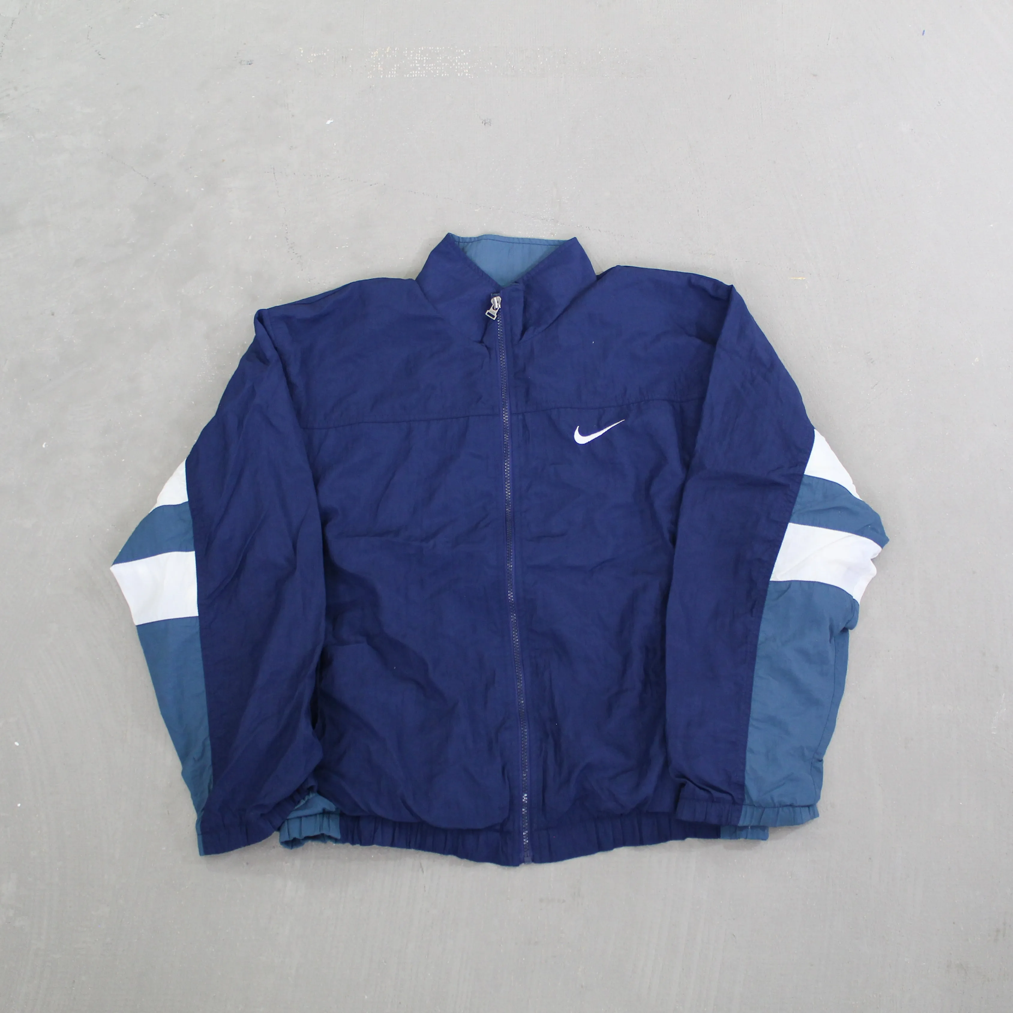 D- Vintage 90s Nike Zip Up Color Block Navy/Teal Windbreaker Jacket sold by HG Vintage