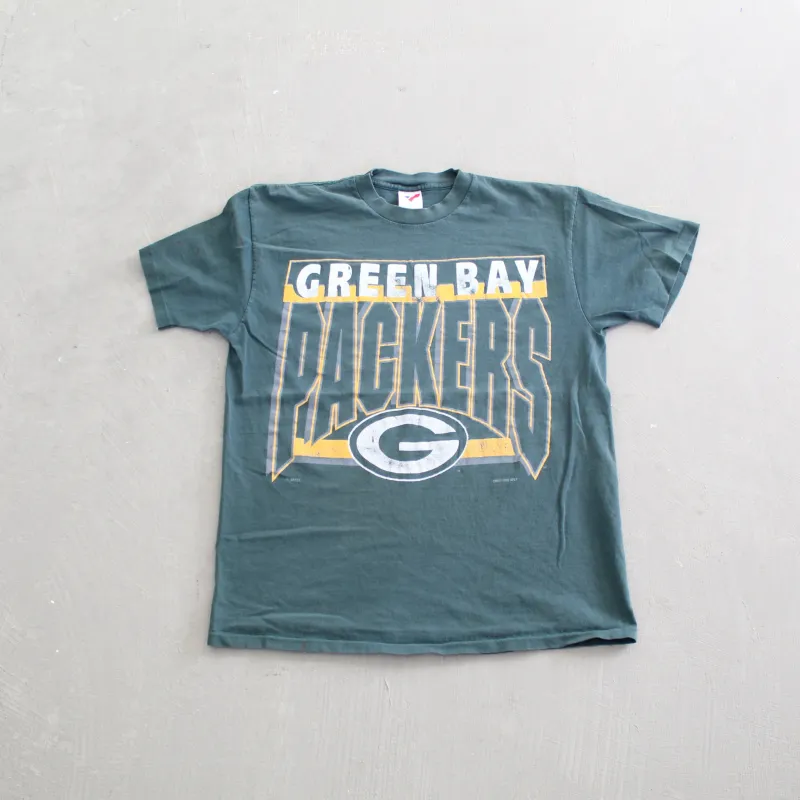 F- Vintage 1992 Green Bay Packers NFL logo & Text Single Stitch Tee sold by HG Vintage