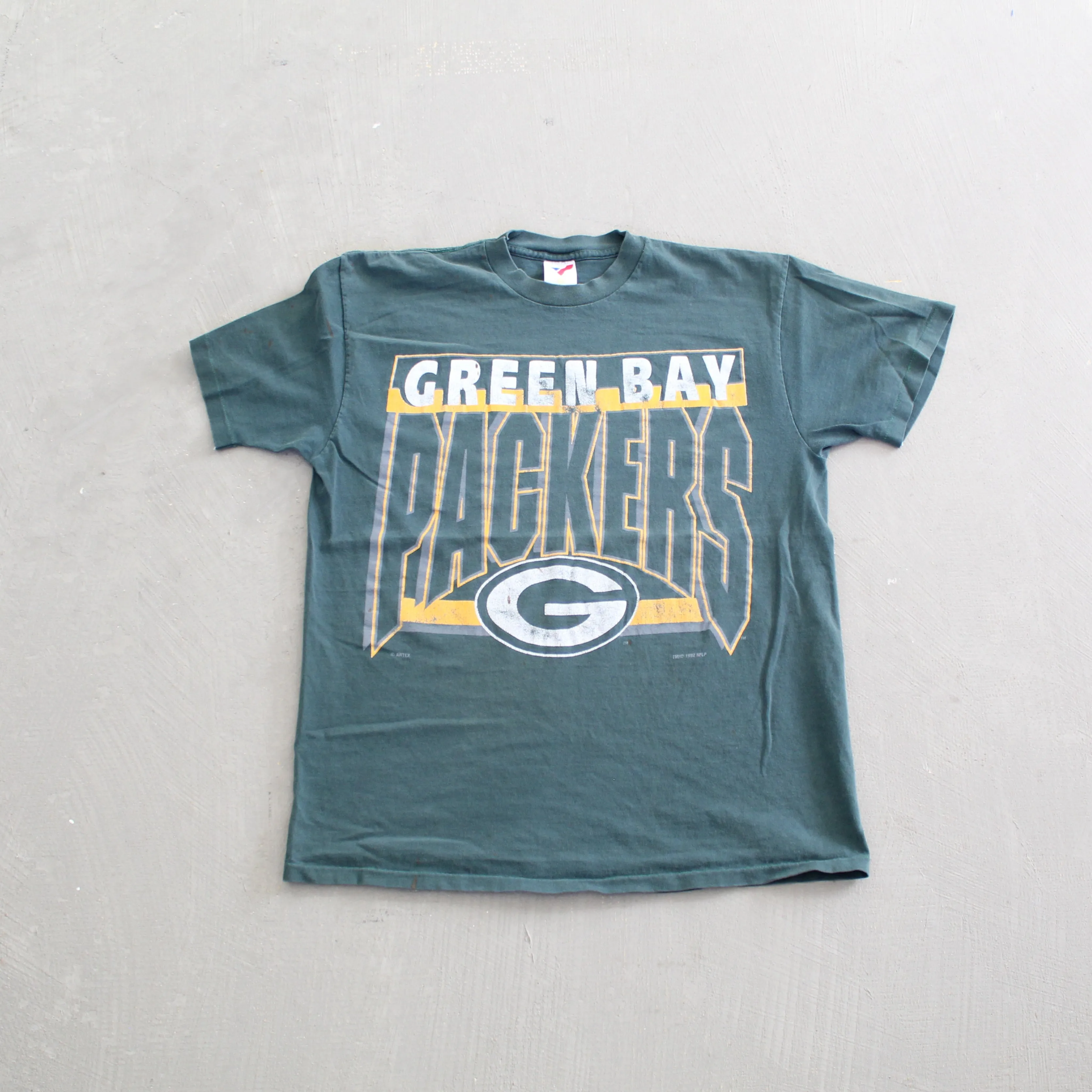 F- Vintage 1992 Green Bay Packers NFL logo & Text Single Stitch Tee sold by HG Vintage