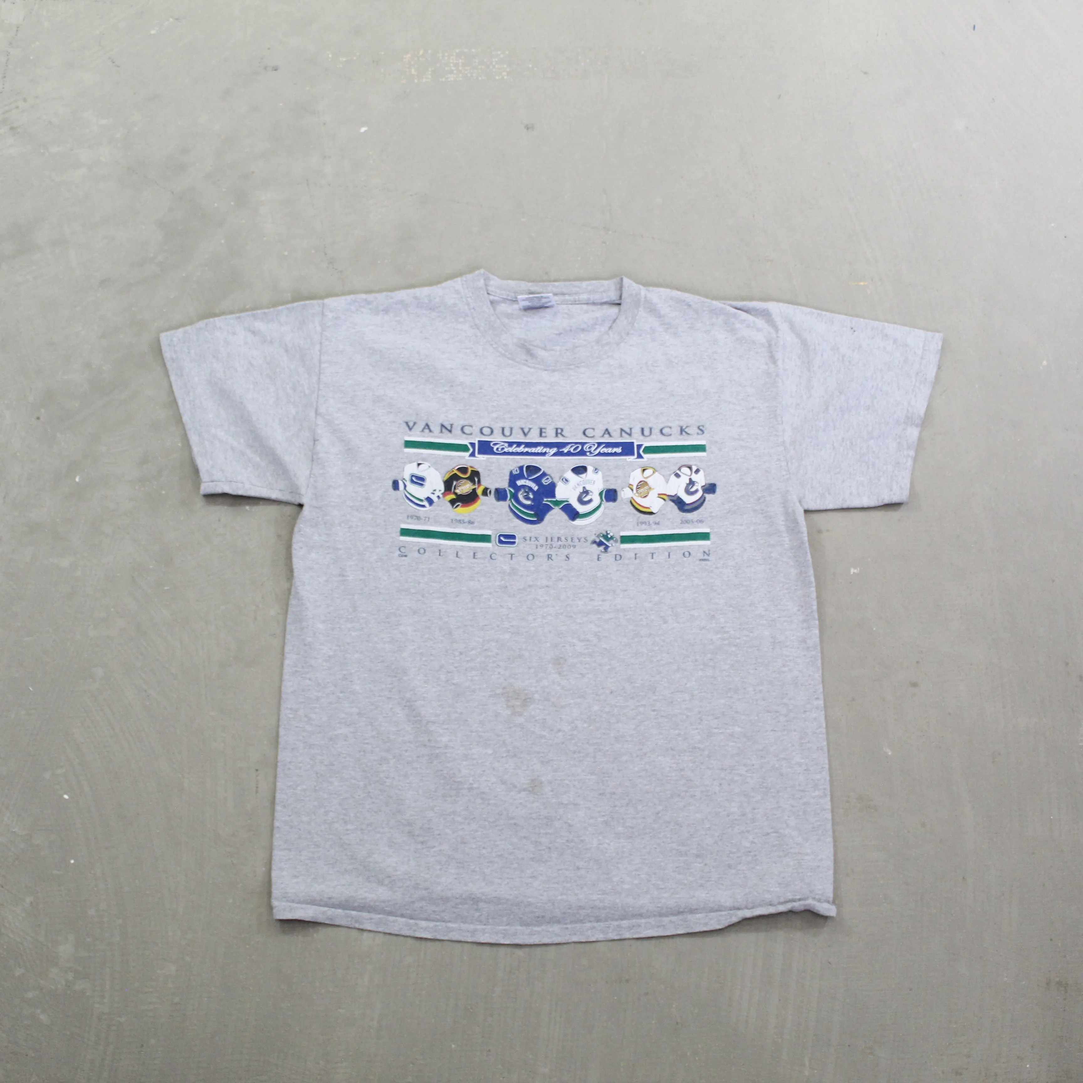 F- 2009 Vancouver Canucks NHL 40 Years Jerseys Tee sold by HG Vintage