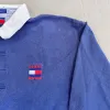 F- Vintage 90s Tommy Hilfiger Embroidered Logo & Crest Rugby Shirt sold by HG Vintage