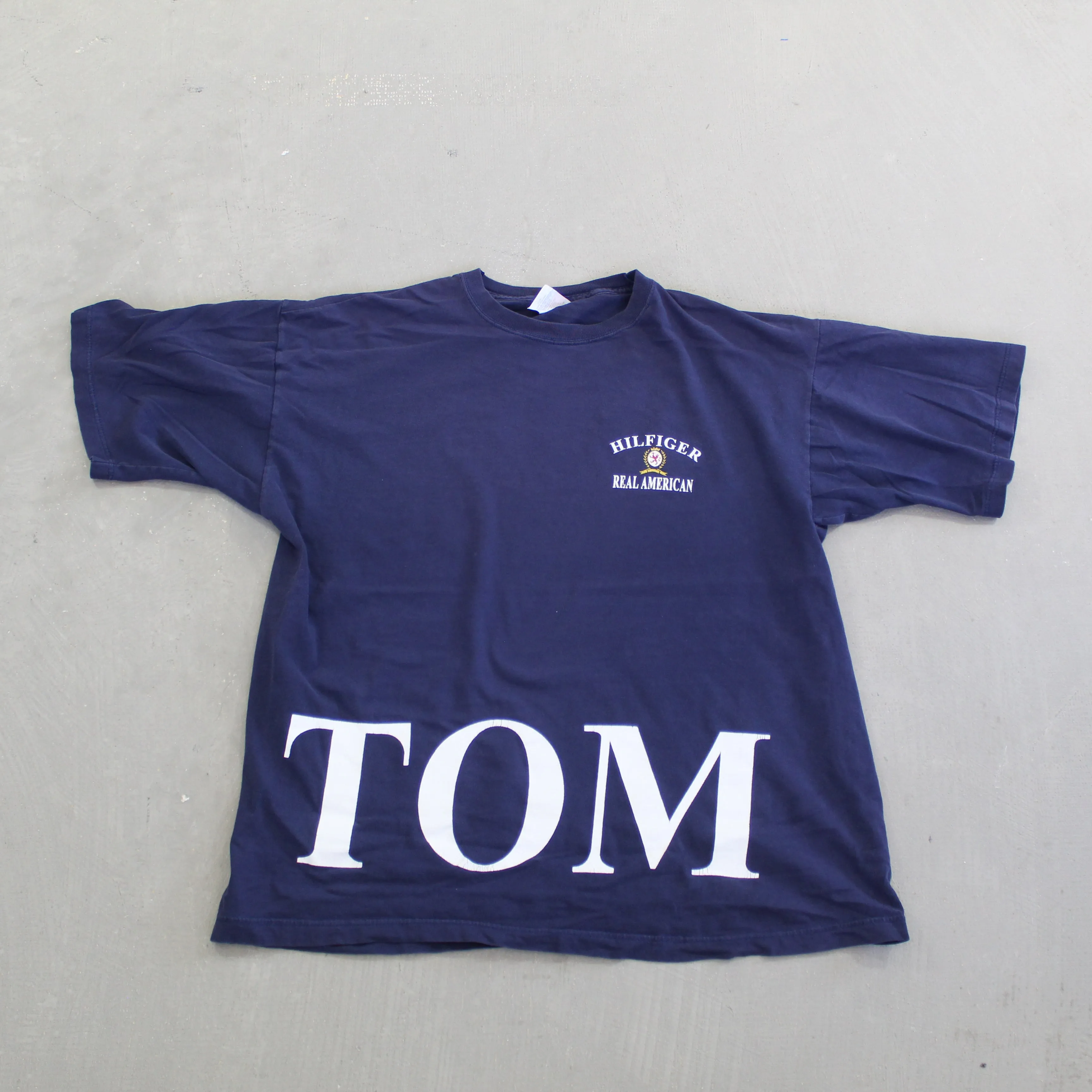F- Vintage Tommy Hilfiger Real American Text Tee sold by HG Vintage