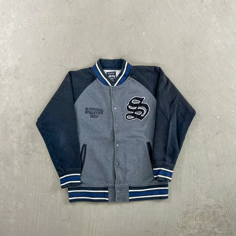 F- Vintage Stussy The International Athletics Tribe Embroidered Text Jacket sold by HG Vintage