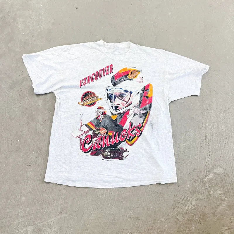 F- Vintage '94 Vancouver Canucks NHL Text & Goalie Picture Single Stitch Game sold by HG Vintage