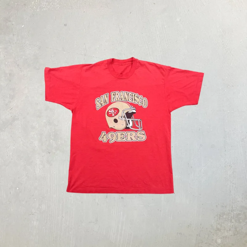 F- Vintage San Francisco 49ers NFL Helmet Graphic Single Stitch Tee sold by HG Vintage