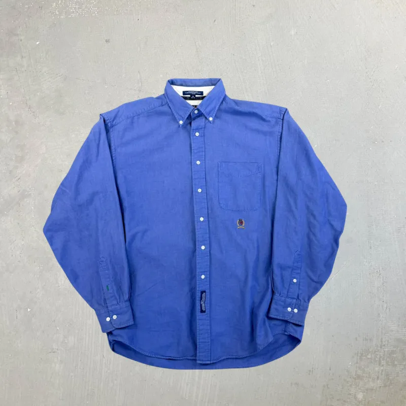 F- Vintage Tommy Hilfiger Solid Color Blue Embroidered Crest Button Down Shirt sold by HG Vintage
