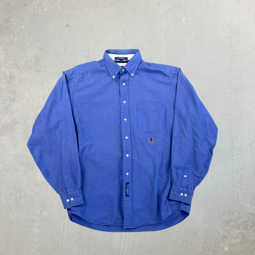 F- Vintage Tommy Hilfiger Solid Color Blue Embroidered Crest Button Down Shirt sold by HG Vintage