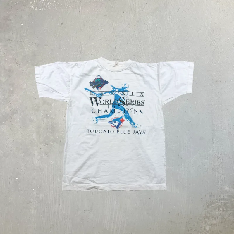 F- Vintage '92 Toronto Blue Jays World Series MLB Champions Text & Batter Single Stitch Tee sold by HG Vintage
