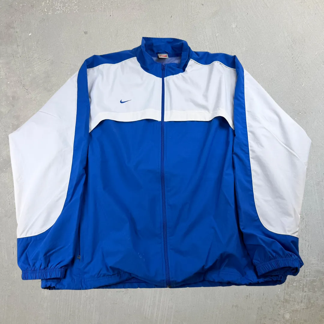 J- Vintage Nike Team Embroidered Swoosh Blue Zip Up Lightweight Jacket - 2XL sold by HG Vintage