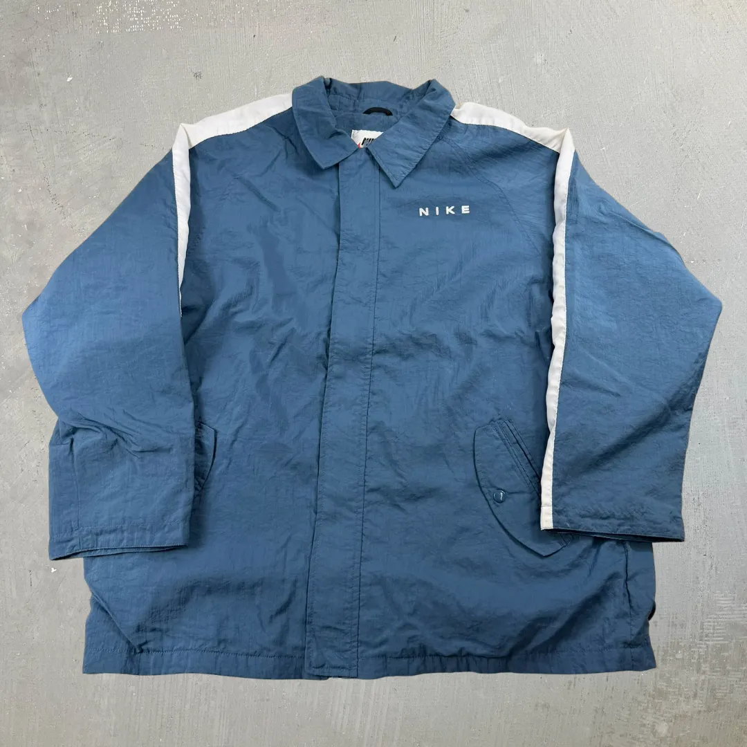 J- Vintage Nike Embroidered Text Light Blue Zip Up Lightweight Jacket - 2XL sold by HG Vintage