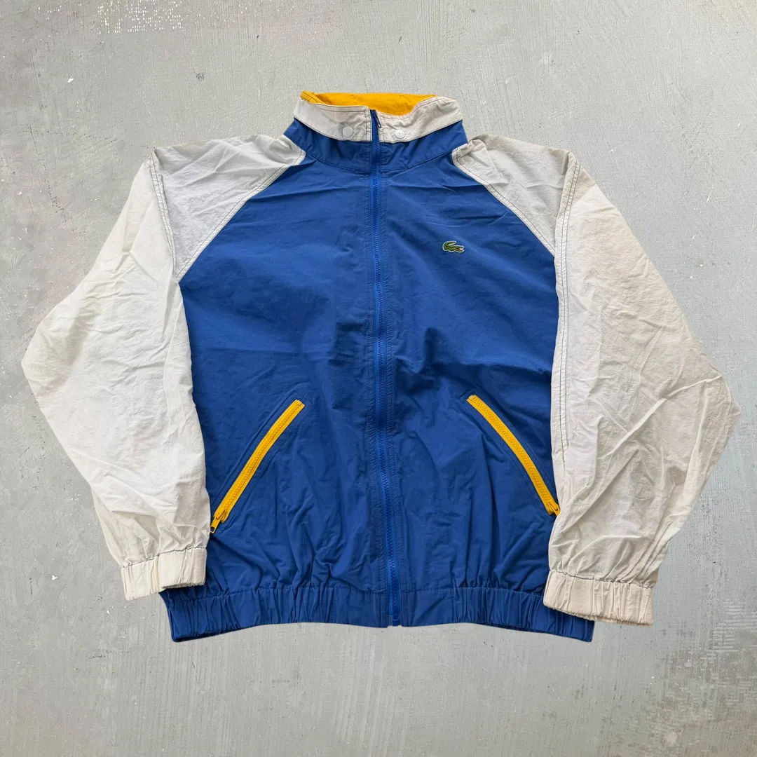 J- Vintage Lacoste Blue/White Zip Up Windbreaker - XL sold by HG Vintage