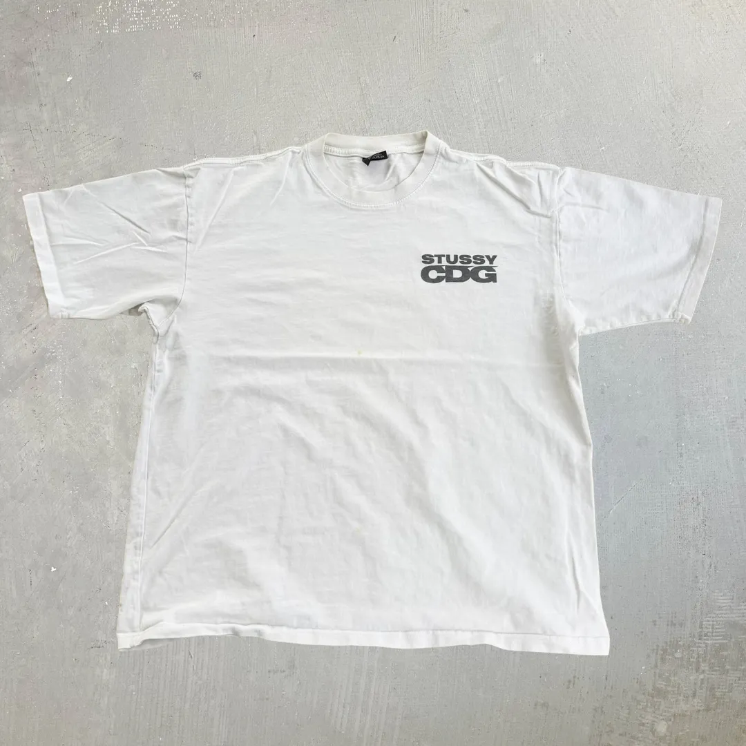 J- '20 Stussy CDG Surfman Graphic Made In USA Tee - L sold by HG Vintage