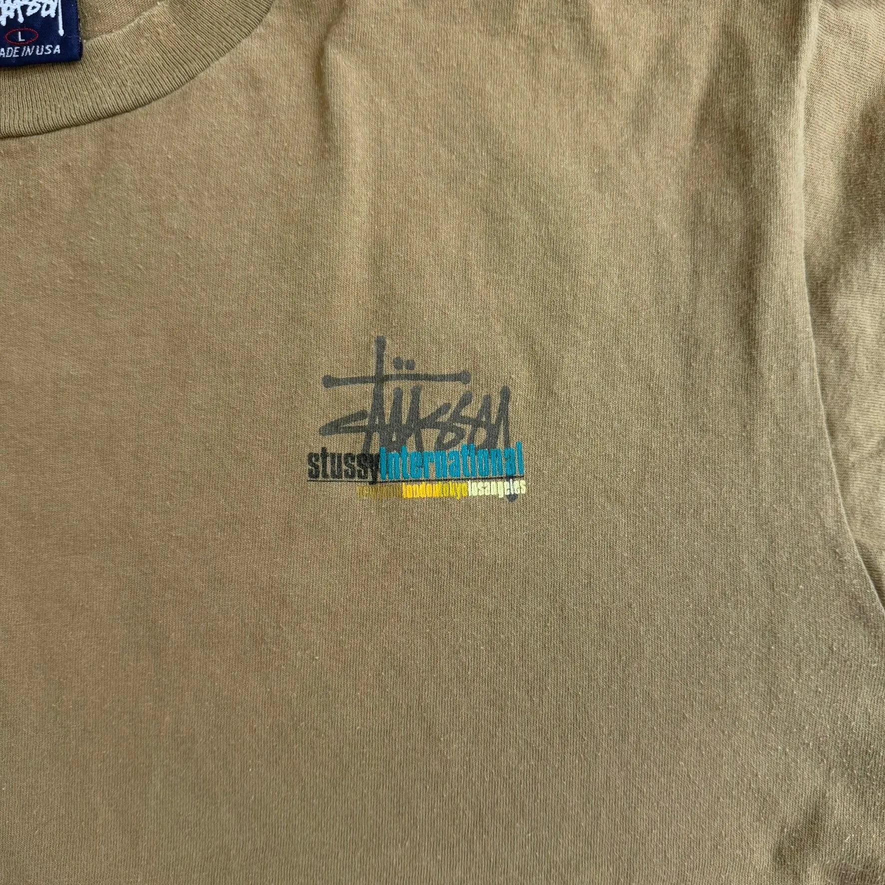 J- Vintage Stussy International Text Made In USA Single Stitch Tee - L sold by HG Vintage product image thumbnail 2