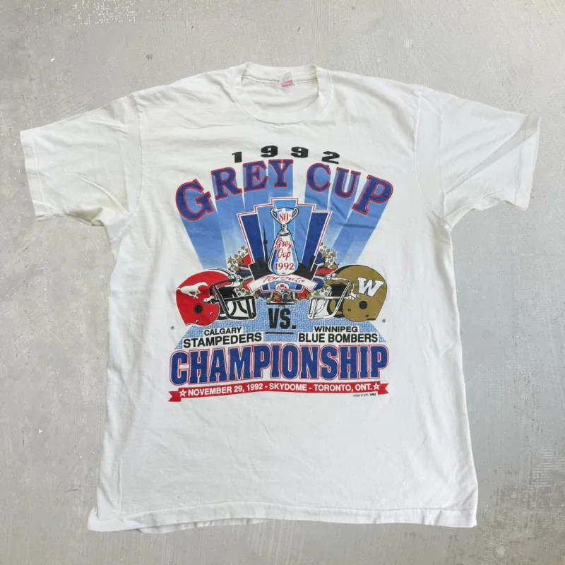 J- Vintage '92 Calgary Stampeders Vs Winnipeg Blue Bombers CFL Grey Cup Graphic Made In USA Single Stitch Tee - XL (fits L) made by HG Vintage