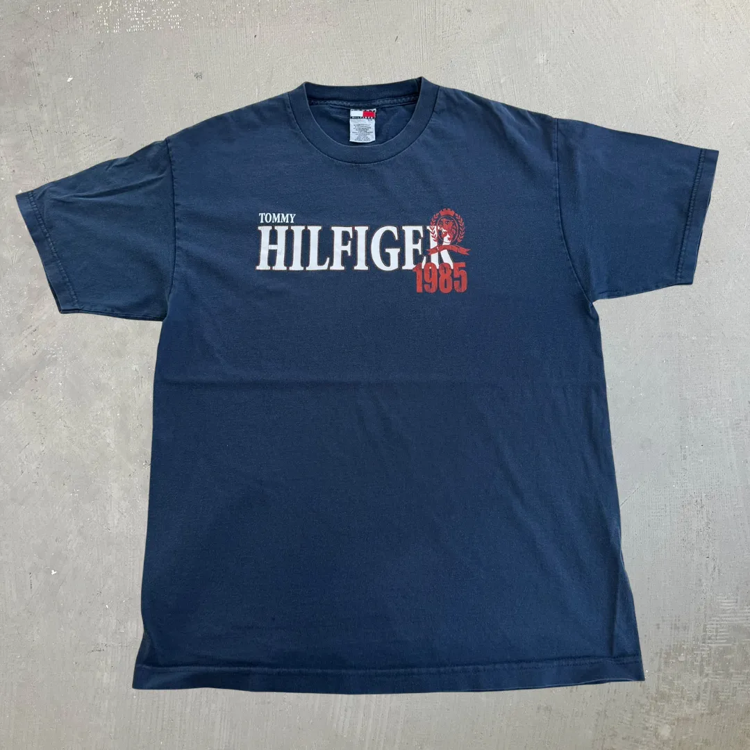 J- Vintage Tommy Hilfiger 1985 Text Graphic Tee - L sold by HG Vintage