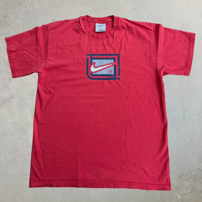 J- Vintage Nike Swoosh & Text Graphic Made In Canada Tee - XL made by HG Vintage