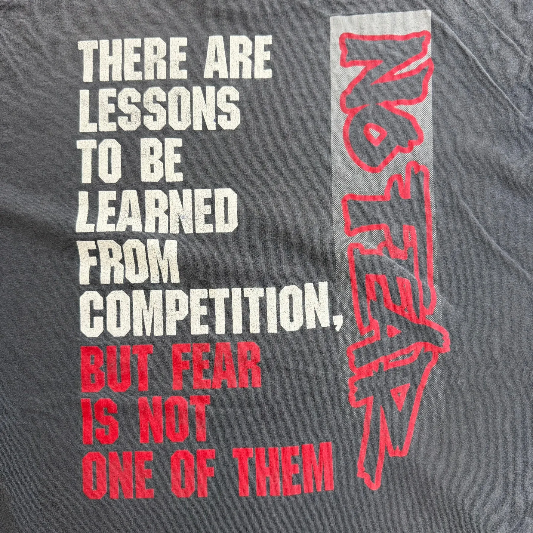 J- Vintage 90s No Fear Lessons In Competitions Graphic Made In USA Single Stitch Tee - XL sold by HG Vintage product image thumbnail 4